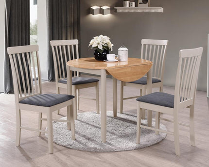 A solid hardwood dining set with a round drop leaf table in a light oak finish and stone grey painted legs, alongside four chairs with charcoal fabric seat pads.