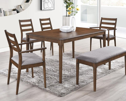 A walnut brown dining set consisting of a rectangular table, four chairs with grey fabric seats, 