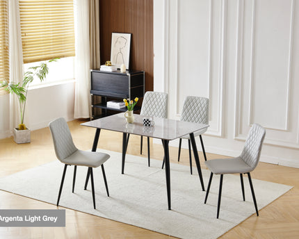 A light grey dining set with a rectangular table and four chairs, featuring a sintered stone top and black metal legs,