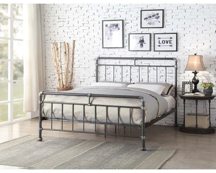A double bed with a silver and black metal frame, 