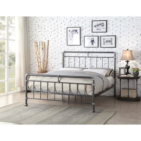 A double bed with a silver and black metal frame, 