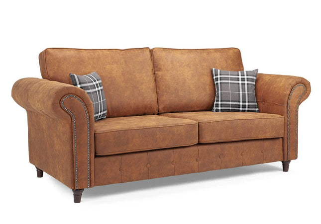 Oakmont 3 seater Sofa  - Tan,  faux leather three seater sofa is soft-to-the-touch and cosy, rounded arms with button detail and  metal studded up the front of the arm.
