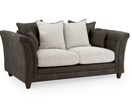 Bella Grey 2 seater sofa . Crafted with a blend of polyester and faux leather. scatter back cushions. removable cushions. stud detail around the frame 