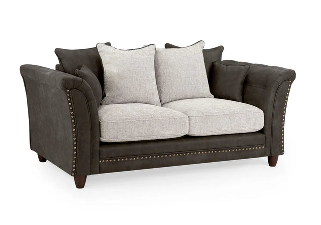 Bella Grey 2 seater sofa . Crafted with a blend of polyester and faux leather. scatter back cushions. removable cushions. stud detail around the frame 