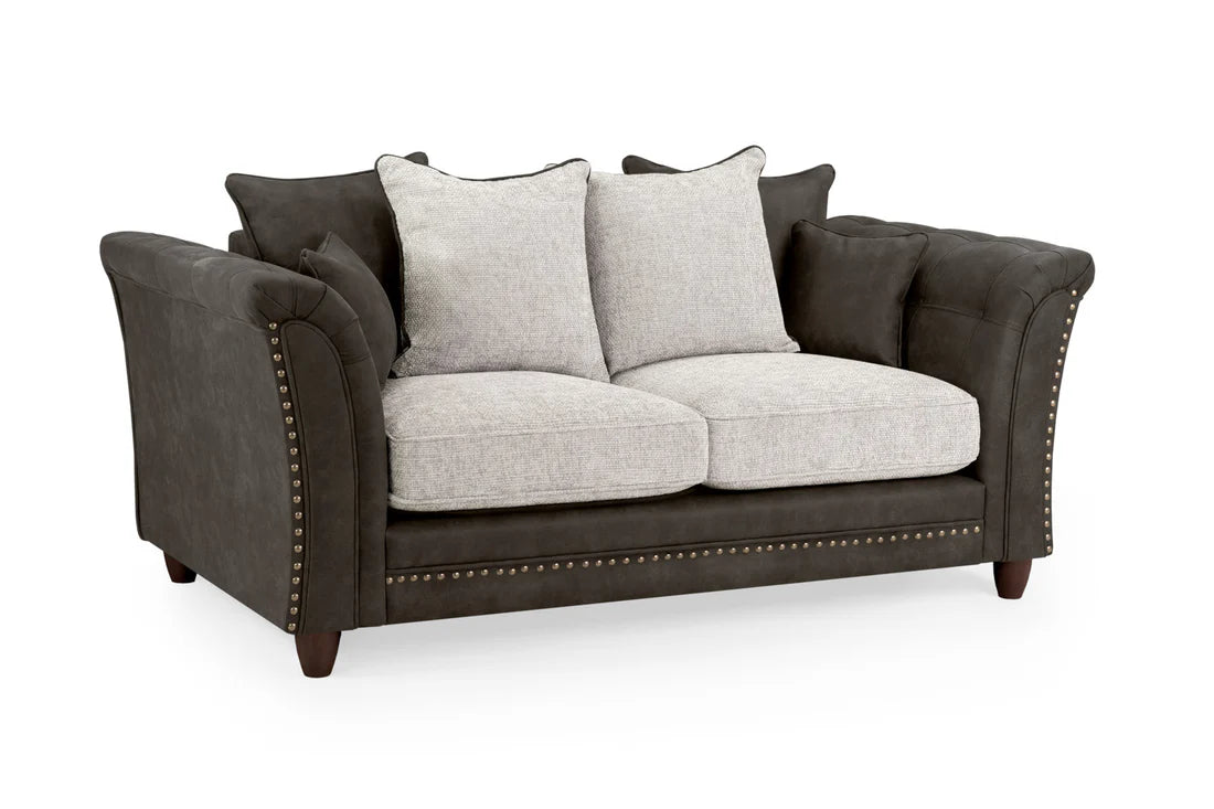 Bella Grey 2 seater sofa . Crafted with a blend of polyester and faux leather. scatter back cushions. removable cushions. stud detail around the frame 