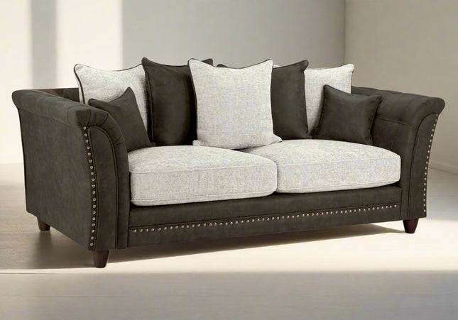 Bella Grey 3 seater sofa. Crafted with a blend of polyester and faux leather. scatter back cushions. removable cushions. stud detail around the frame 