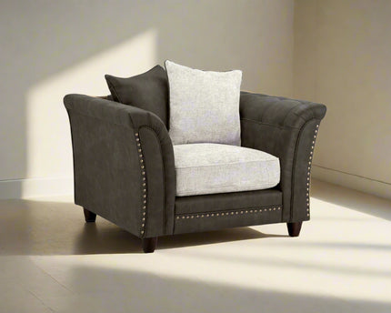 Bella Grey 2 seater sofa . Crafted with a blend of polyester and faux leather. scatter back cushions. removable cushions. stud detail around the frame 
