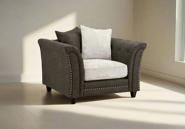 Bella Grey 2 seater sofa . Crafted with a blend of polyester and faux leather. scatter back cushions. removable cushions. stud detail around the frame 