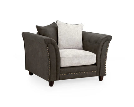 Bella Grey armchair . Crafted with a blend of polyester and faux leather. scatter back cushions. removable cushions. stud detail around the frame 