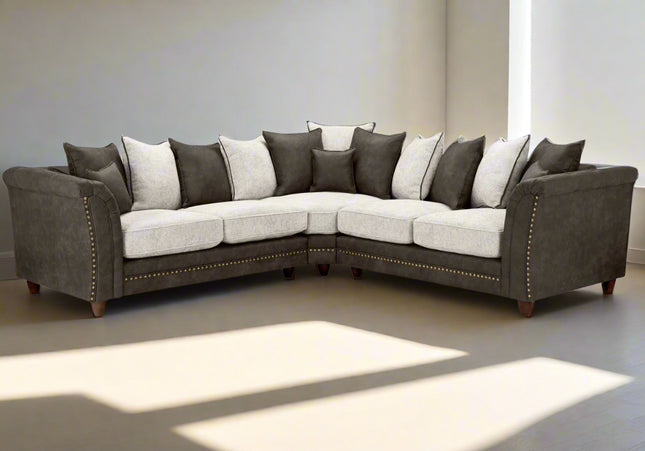 Bella Grey 2c2 sofa. Crafted with a blend of polyester and faux leather. scatter back cushions. removable cushions. stud detail around the frame 
