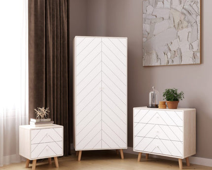 Set of white two-door wardrobe chest of drawers and a two draw bed side table  chevron pattern.