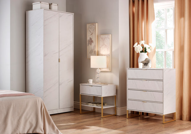 A white bedroom furniture t including a wardrobe, a chest of drawers, and a bedside table set marble effect with gold metal handles and legs, 