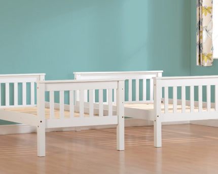 Two white wooden beds 