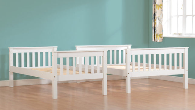 Two white wooden beds 