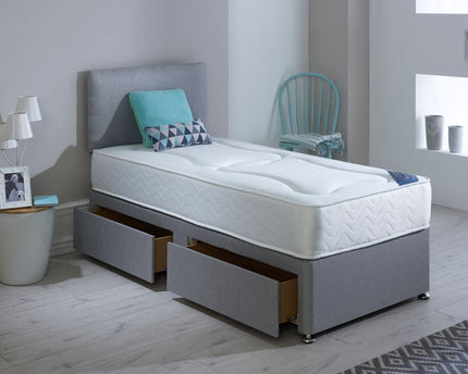 A single divan bed with a gray headboard and base, featuring drawers for storage, upholstered in Linoso Silver fabric.