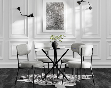 Round Glass Dining room table with black legs and white chairs 