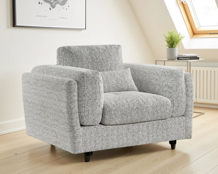 The Bari armchair plush comfort with  soft plump cushions and gentle arm cushions. In grey