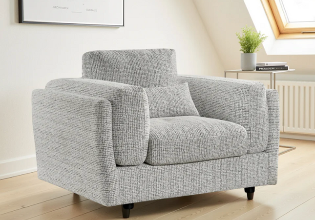 The Bari armchair plush comfort with  soft plump cushions and gentle arm cushions. In grey
