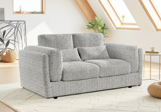 The Bari 3 Seater plush comfort with  soft plump cushions and gentle arm cushions. In grey