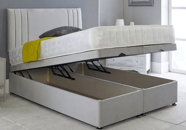 A gray upholstered ottoman divan bed with a headboard, featuring a storage compartment beneath the mattress.