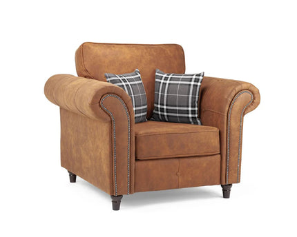 Oakmont armchair  - Tan,  faux leather armchair is soft-to-the-touch and cosy, rounded arms with button detail and  metal studded up the front of the arm.