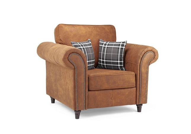 Oakmont armchair  - Tan,  faux leather armchair is soft-to-the-touch and cosy, rounded arms with button detail and  metal studded up the front of the arm.