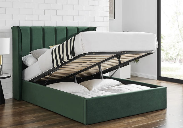 Emerald green velvet ottoman bed with a winged headboard and storage space beneath, 