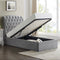 A single-sized Rosa ottoman bed with a button style headboard in light grey, the bed is lifted to show the storage space inside.