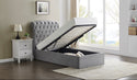 A single-sized Rosa ottoman bed with a button style headboard in light grey, the bed is lifted to show the storage space inside.