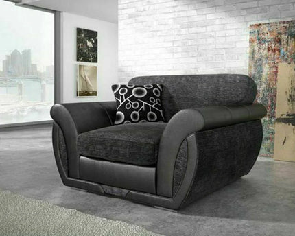 Shannon armchair In Charcoal  Charcoal chenille fabric with sleek black faux leather trims scatter back cushions with circle patterns you can turn them and have plain cushions