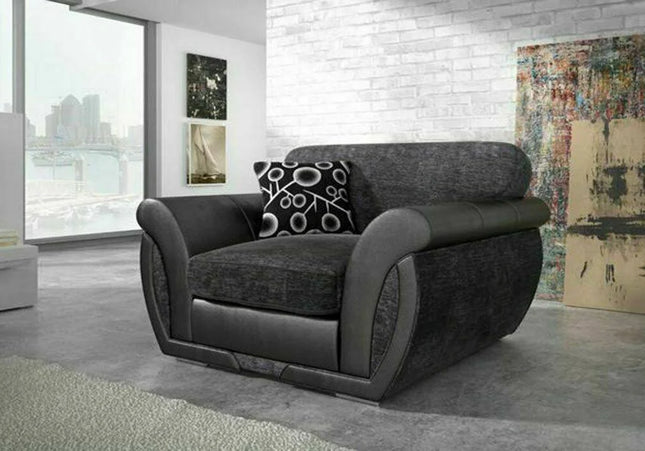 Shannon armchair In Charcoal  Charcoal chenille fabric with sleek black faux leather trims scatter back cushions with circle patterns you can turn them and have plain cushions