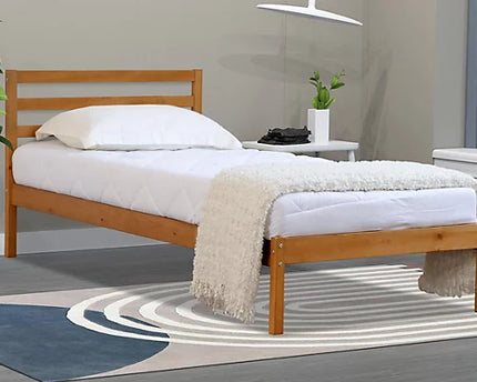 A single Oak bed frame made with headboard