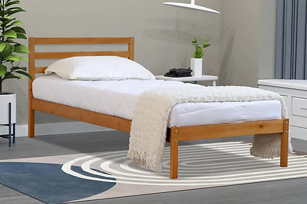 A single Oak bed frame made with headboard
