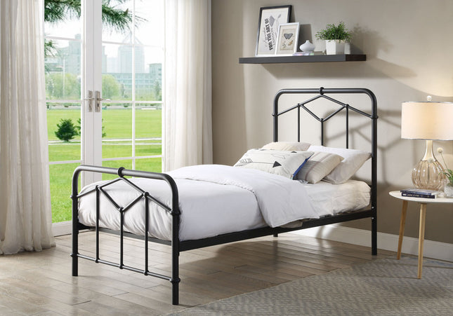 A single black metal bed frame with a white mattress on it,