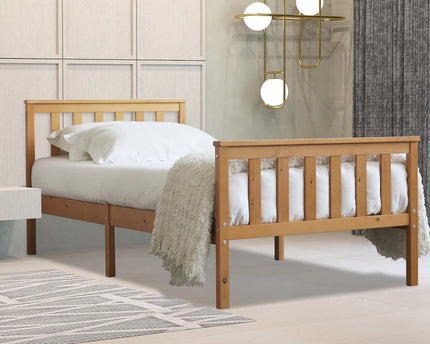 A single oak bed frame with a white mattress and paneled head and foot board