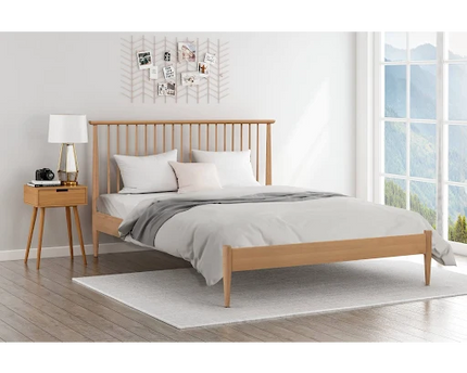 A double bed with a Pine wooden frame, a white mattress, 